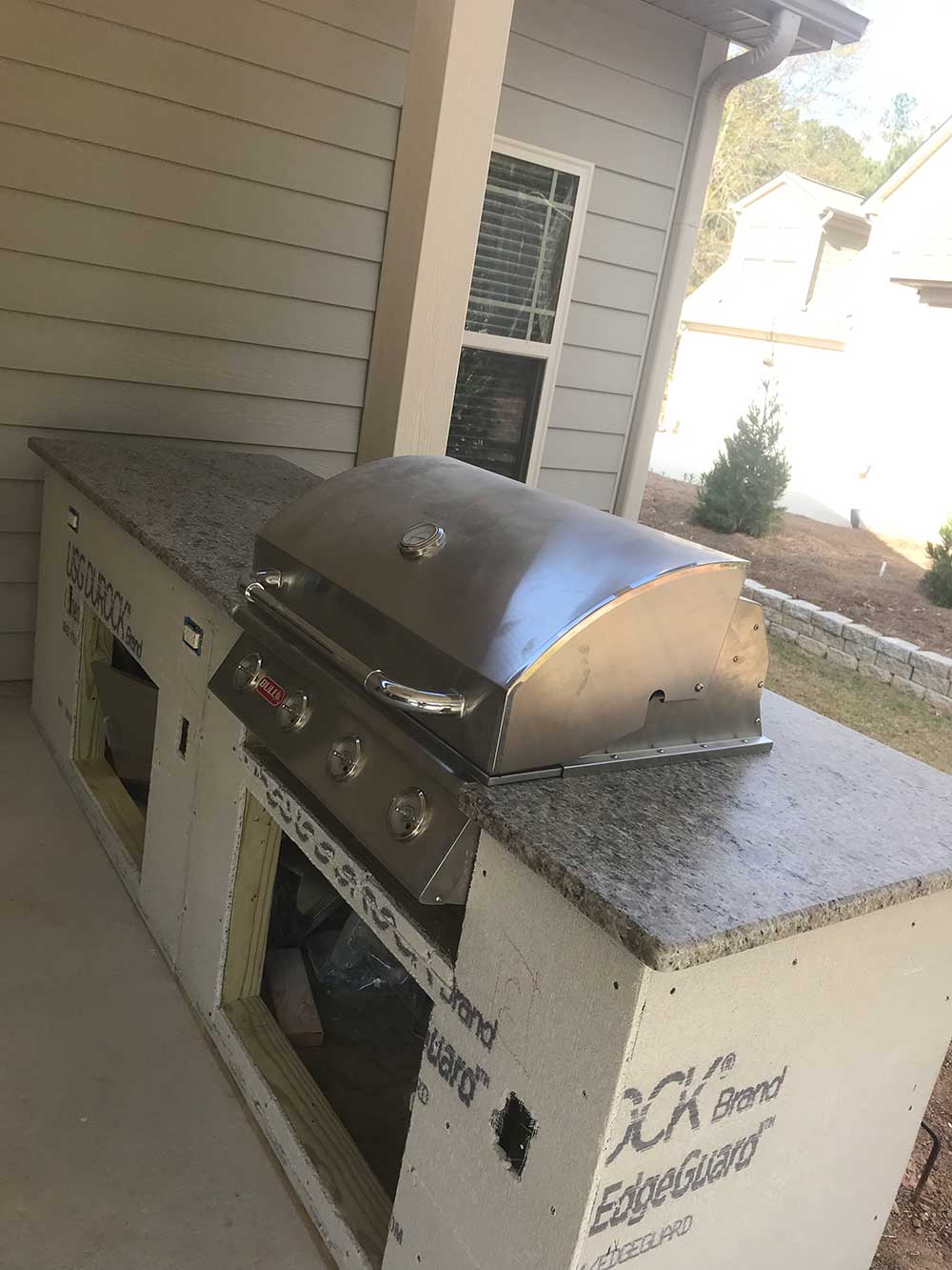 Photo of Caramalo granite installed in BBQ area.
