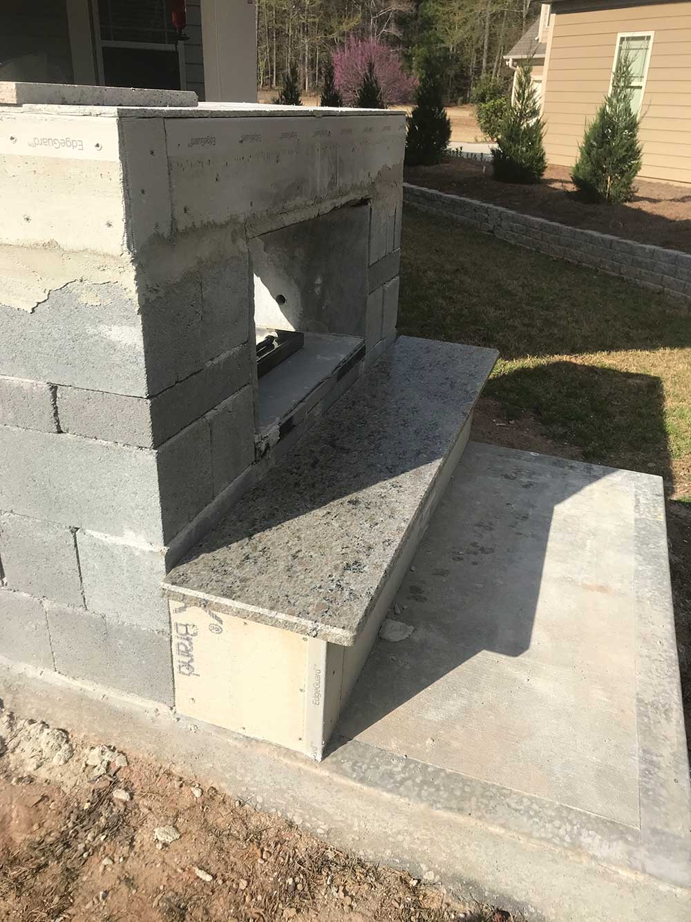 Photo of Caramalo granite installed in BBQ area.